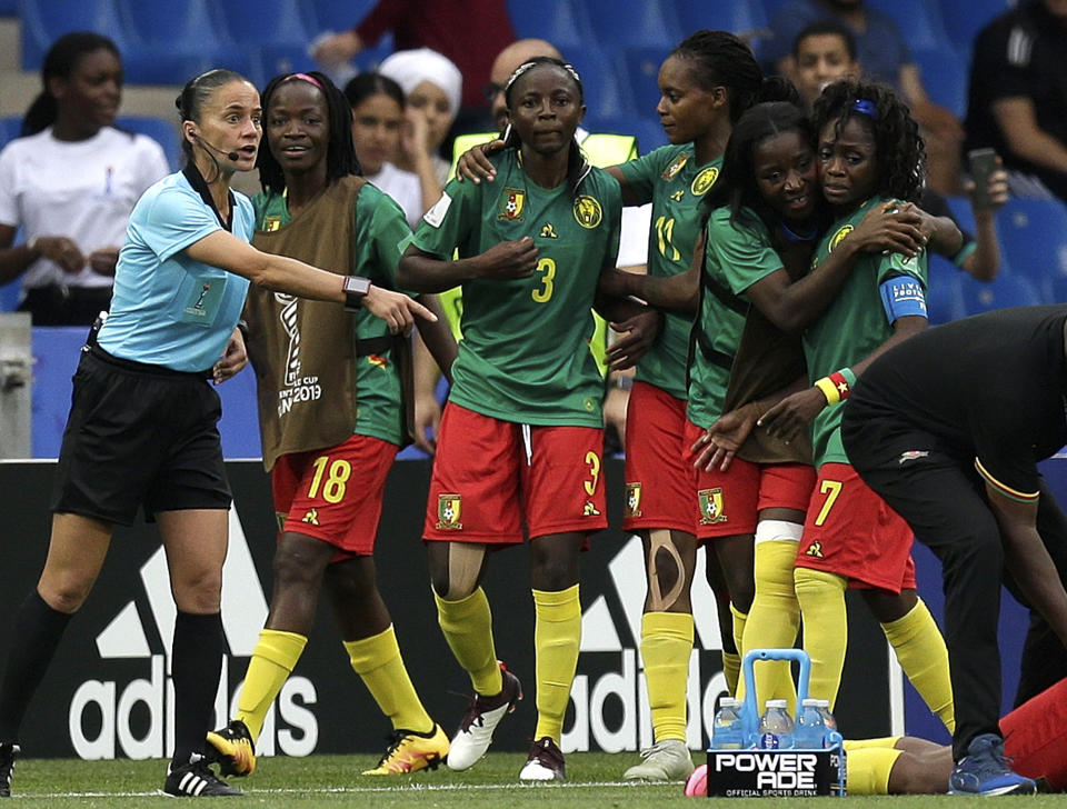 Cameroon's Ajara Nchout, center, celebrates after scoring her side's second goal during the Women's World Cup Group E soccer match between Cameroon and New Zealand at the Stade de la Mosson in Montpellier, France, Thursday, June 20, 2019. (AP Photo/Claude Paris)