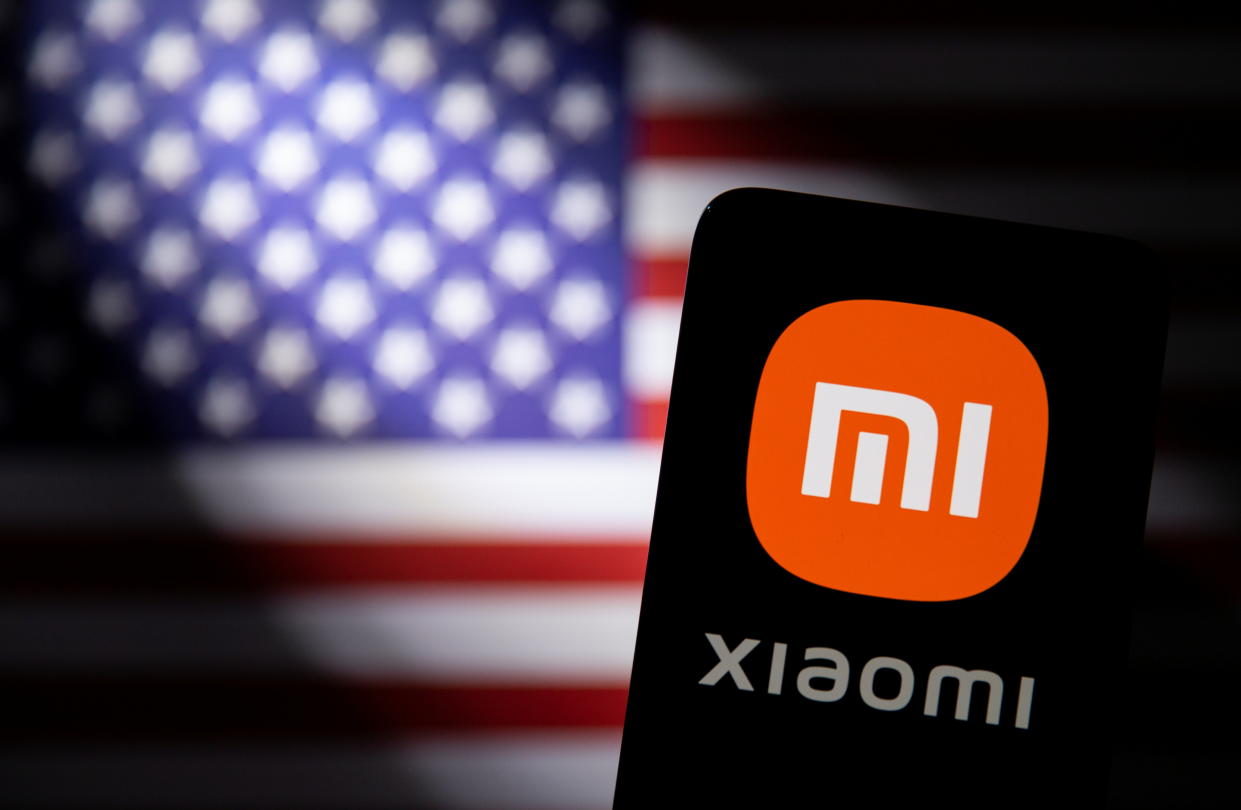 Smartphone with a Xiaomi logo is seen in front of a U.S. flag in this illustration taken September 28, 2021. REUTERS/Dado Ruvic/Illustration