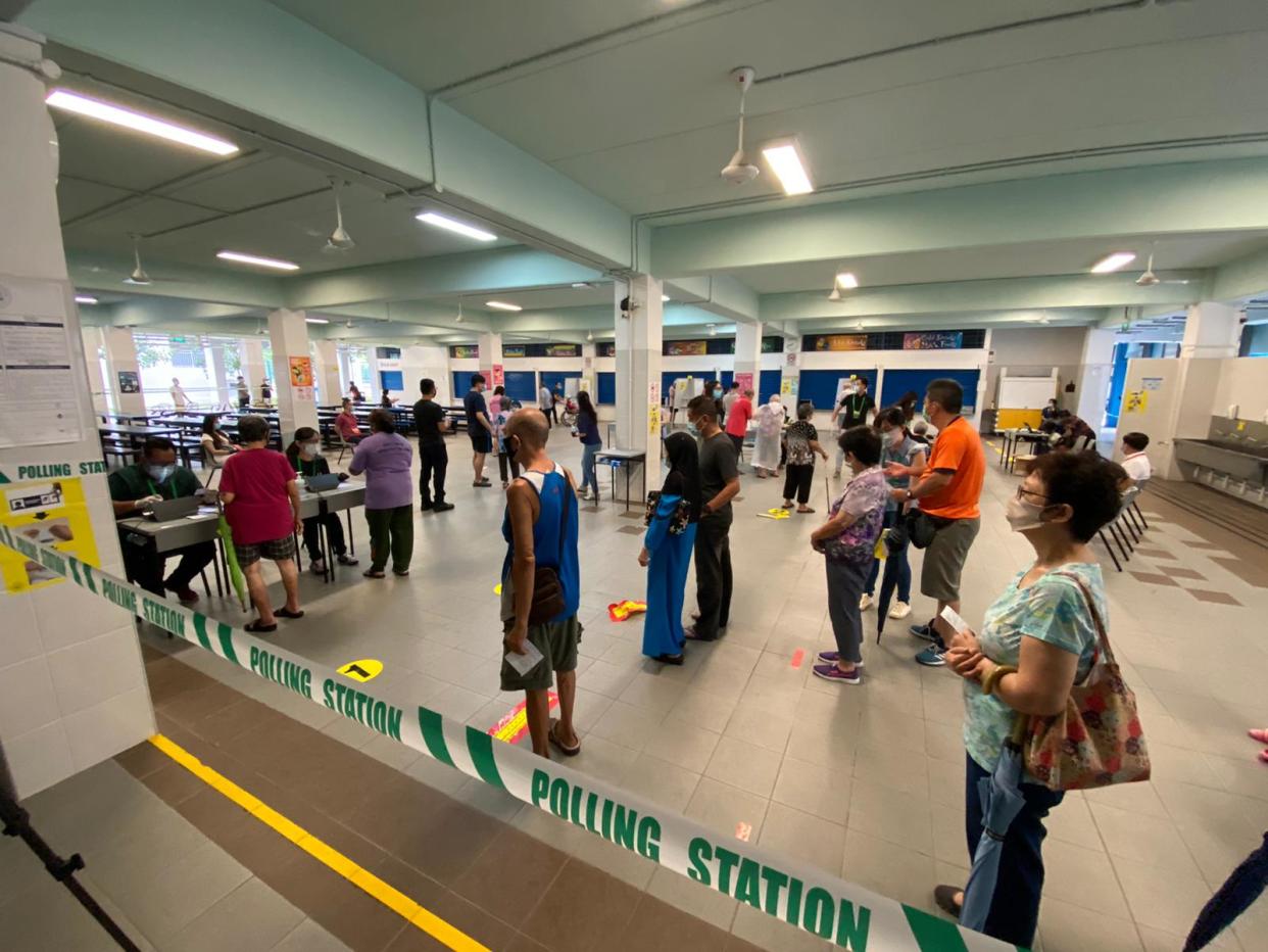 Queuing to vote at Dunearn Secondary School, while observing safe distancing in Singapore's GE2020. (Photo: Dhany Osman)