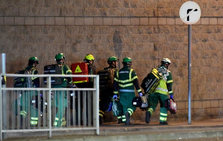 Medics and rescuers deploy after a suspected explosion ripped through a crowd of concert-goers in the northern English city of Manchester