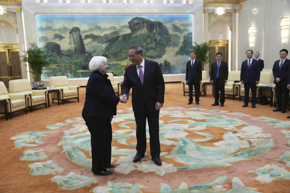 U.S. Treasury Secretary Janet Yellen, left, meets Chinese Premier Li Qiang at the Great Hall of the People in Beijing, China, Sunday, April 7, 2024. Yellen, who arrived later in Beijing after starting her five-day visit in one of China's major industrial and export hubs, said the talks would create a structure to hear each other's views and try to address American concerns about manufacturing overcapacity in China. (AP Photo/Tatan Syuflana, Pool)