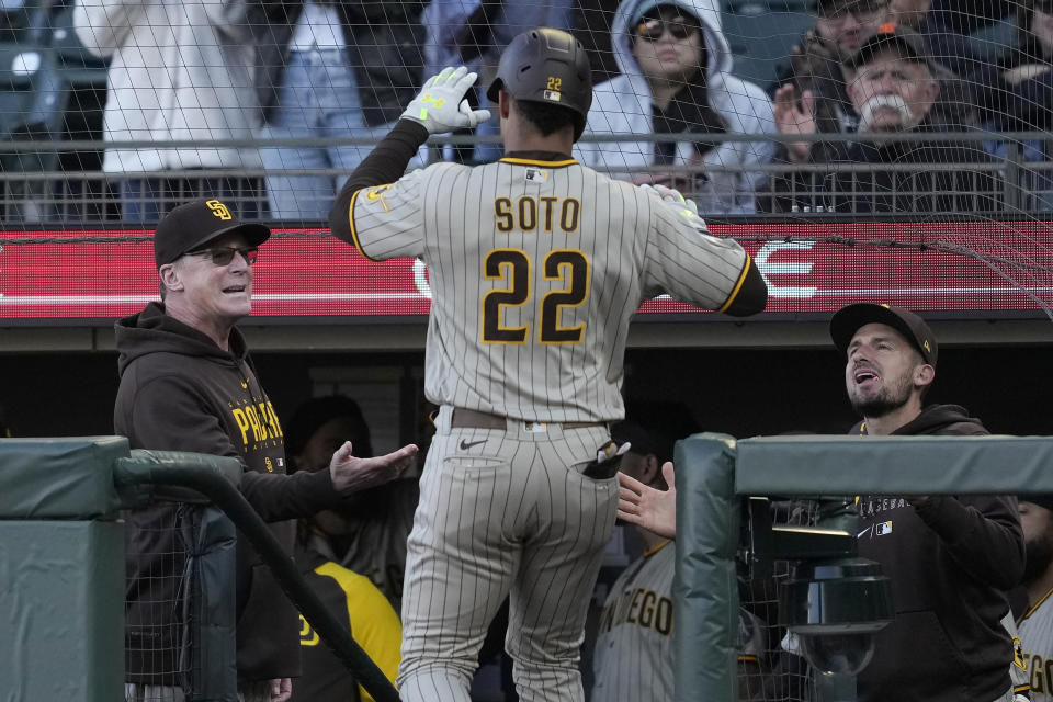 San Diego Padres' Juan Soto (22) is congratulated by manager Bob Melvin, left, after hitting a home run during the first inning of a baseball game against the San Francisco Giants in San Francisco, Monday, June 19, 2023. (AP Photo/Jeff Chiu)