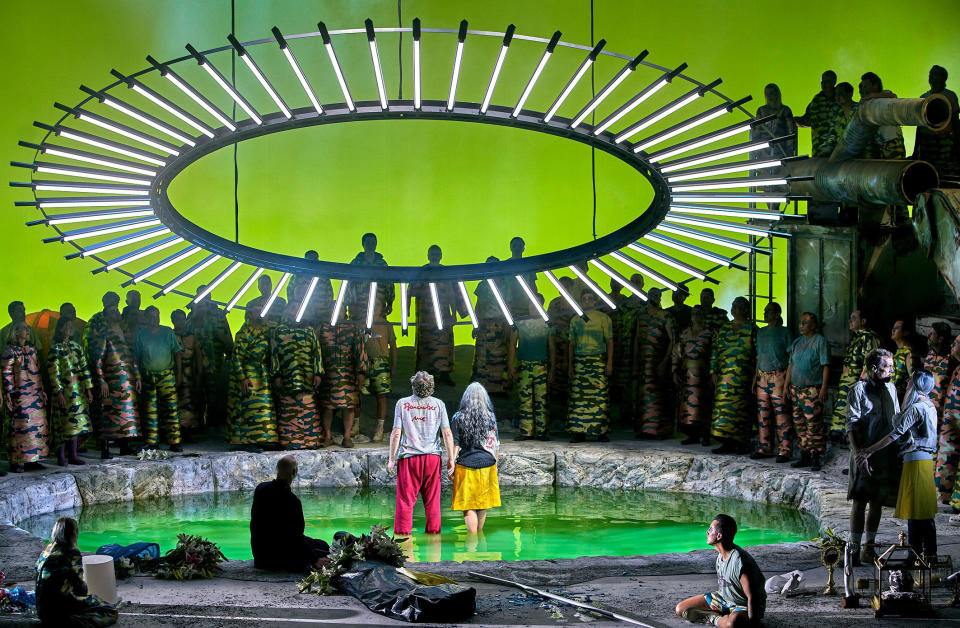 Tenor Andreas Schager, center left, as Parsifal, and mezzo-soprano Elīna Garanča as Kundry, appear in the third act of Jay Scheib's production of Wagner's "Parsifal" at the Bayreuth Festival 2023 in Bayreuth, Germany. (Enrico Nawrath/Bayreuth Festival via AP)