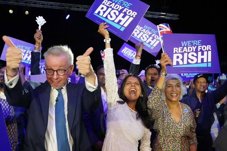 Michael Gove and Akshata Murthy cheer Rishi Sunak (PA)