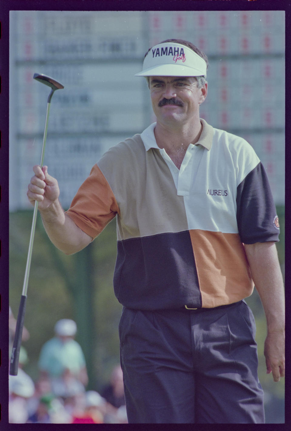 Scott Simpson acknowledges crowd holding putter at the Augusta National Golf Course during the 1992 Masters. Mandatory Credit: Margaret Sellers -The Augusta Chronicle via USA TODAY NETWORK