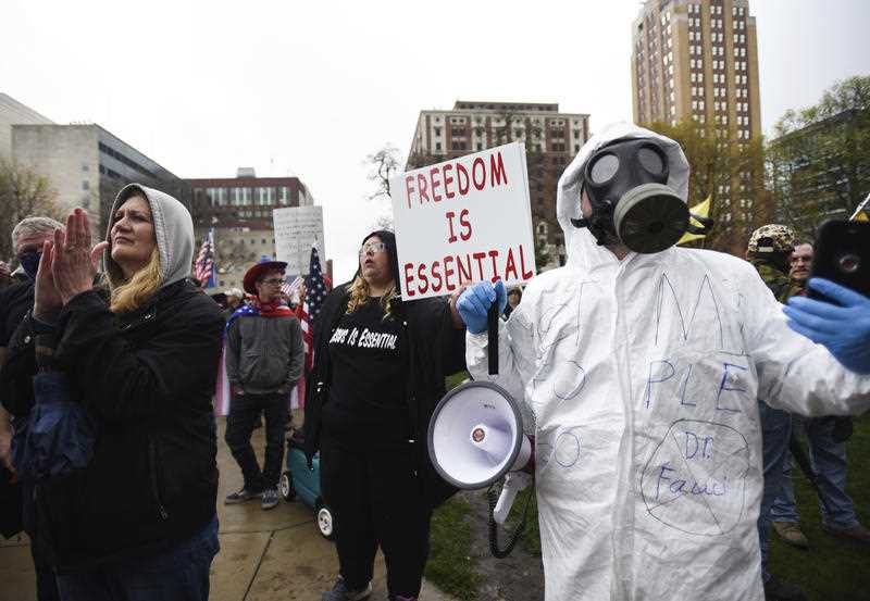 Protesters rally at the state Capitol in Lansing, Michigan.