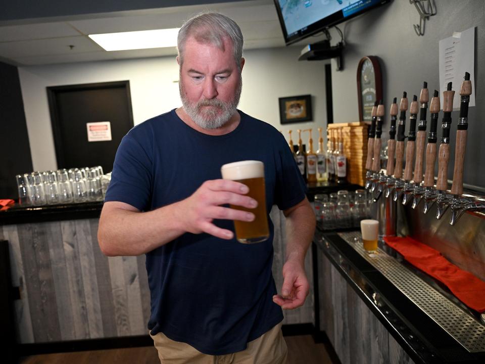 Bartender Chris Barber serves a cold one Tackle Box Brewing Company in Marlborough, August 27, 2021.  