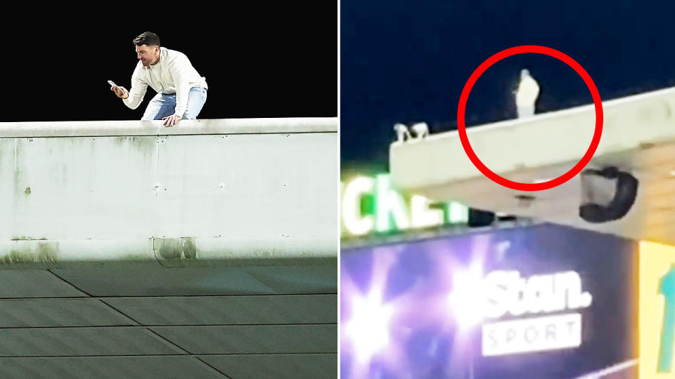 The man, pictured here after climbing onto the roof of the stand at the SCG. 