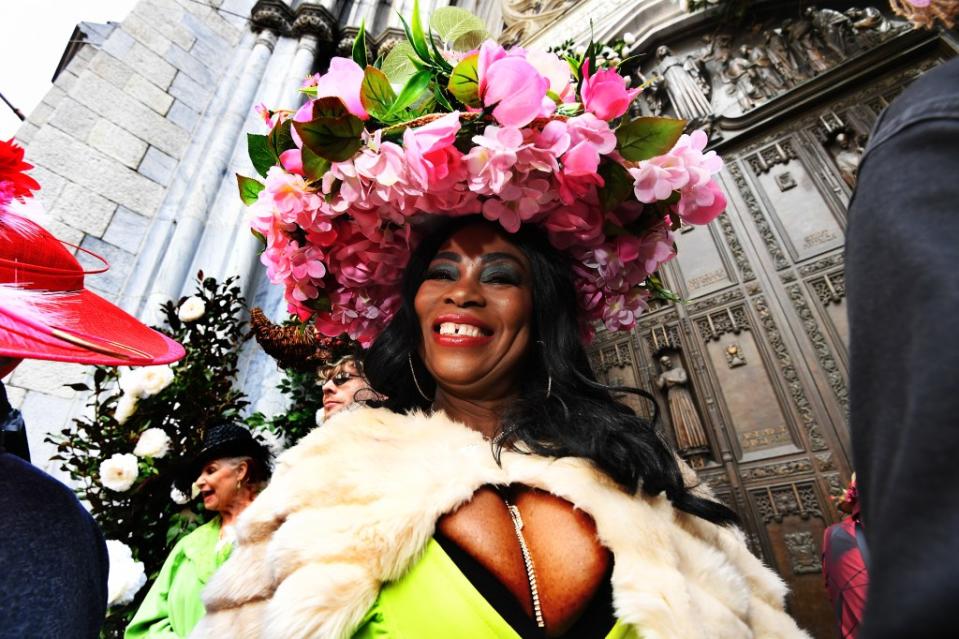 A reveler smiles brightly in their colorful outfit outside of St. Patrick’s Cathedral. Matthew McDermott