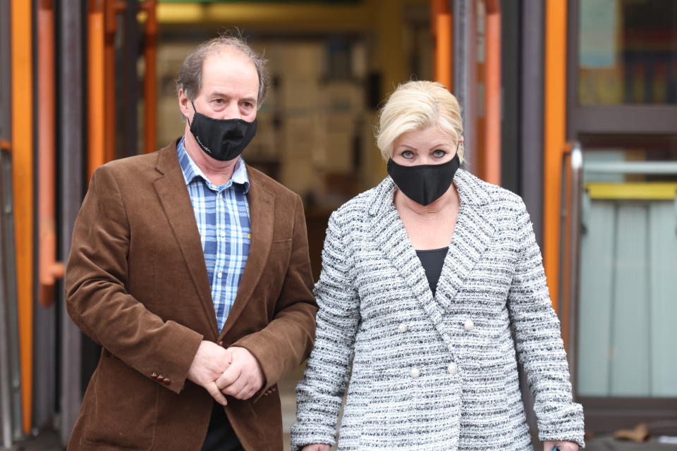 Sandra Durdin, 58, and Trevor Dempsey, 62 from Chingford, leave Thames Magistrates' Court, east London, where they denied flooding their neighbour's alleyway by overwatering plants and putting barbed wire on garden fencing as part of a harassment campaign that lasted for more than a year. Picture date: Thursday December 30, 2021.