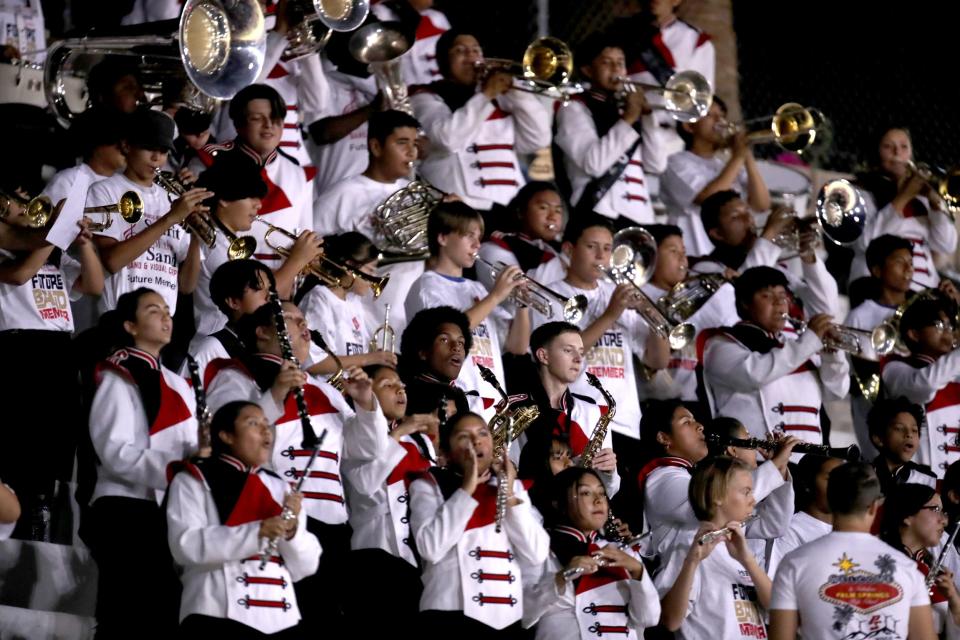Palm Springs High School Spirit of the Sands Marching Band and Raymond Cree Middle School eighth-grade band members perform during the game against Xavier Prep in Palm Springs, Calif., on Friday, October 20, 2023.