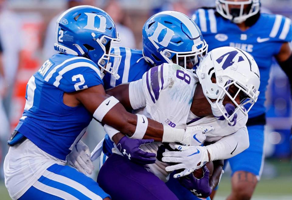 Duke’s Jaylen Stinson and Tre Freeman bring down Northwestern’s A.J. Henning during the second half of the Blue Devils’ 38-13 win on Saturday, Sept. 16, 2023, at Wallace Wade Stadium in Durham, N.C. Kaitlin McKeown/kmckeown@newsobserver.com