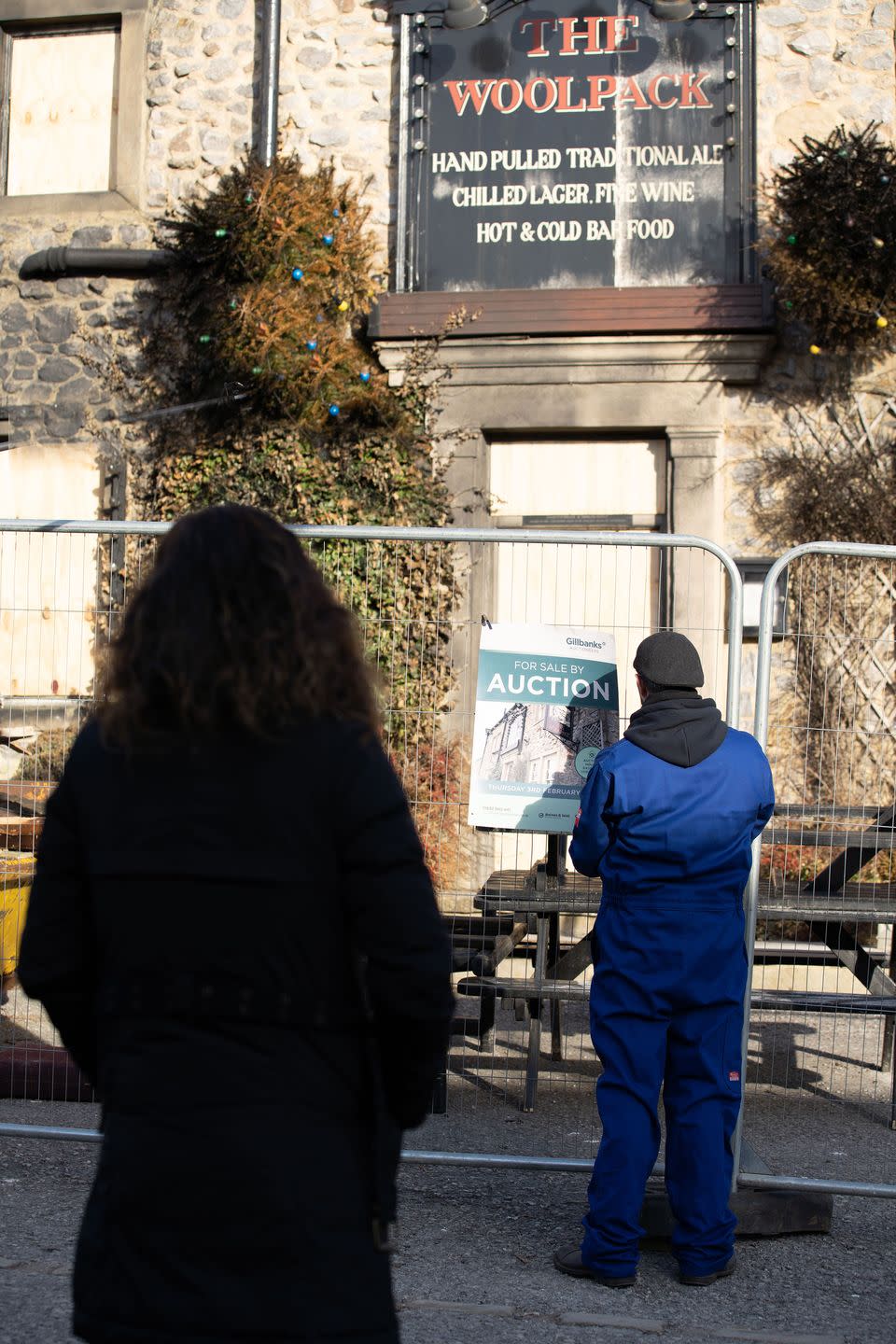 Monday, January 24: A "for auction" sign is put up outside The Woolpack