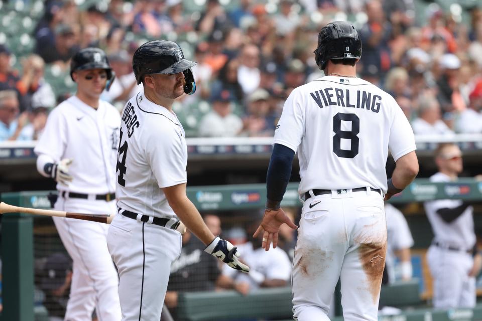 Matt Vierling of the Detroit Tigers celebrates scoring a run in the first inning with Jake Rogers #34 while playing the Cincinnati Reds at Comerica Park on September 14, 2023 in Detroit, Michigan.