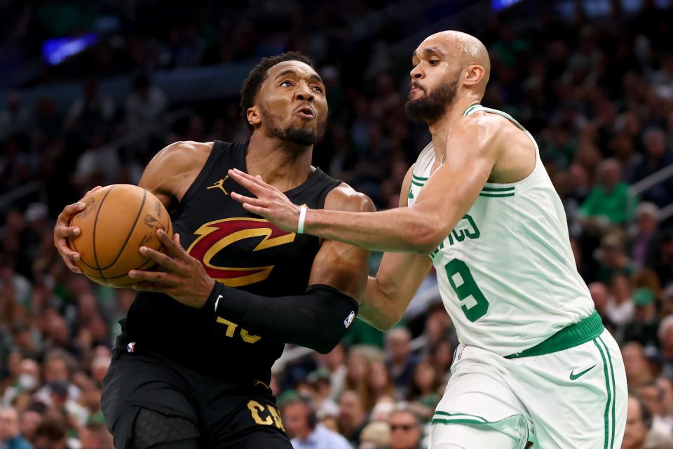 Cavs guard Donovan Mitchell drives to the basket against Derrick White of the Celtics during the third quarter in Game 1 of the Eastern Conference semifinals, May 7, 2024, in Boston.