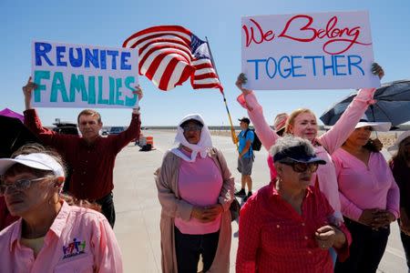 FILE PHOTO: A small group of demonstrators protests outside of the children's tent encampment built to deal with the Trump administrations "zero tolerance" policy in Tornillo, Texas, U.S. June 21, 2018. REUTERS/Mike Blake/File Photo