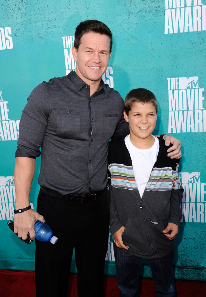 Mark Wahlberg and guest arrive at the 2012 MTV Movie Awards.