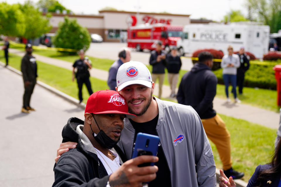 Buffalo Bills' Josh Allen visits the scene of Saturday's shooting at a supermarket, in Buffalo, N.Y., Wednesday, May 18, 2022. (AP Photo/Matt Rourke)