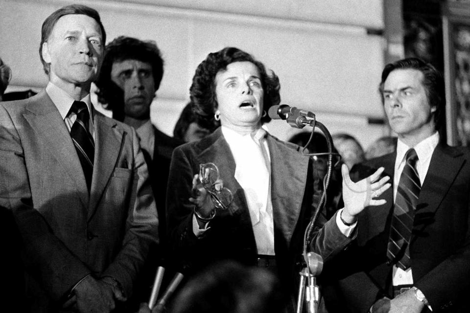 <p>AP Photo</p> Acting Mayor Dianne Feinstein with Police Chief Charles Gain at left, addresses the more than 25,000 people jammed around San Francisco