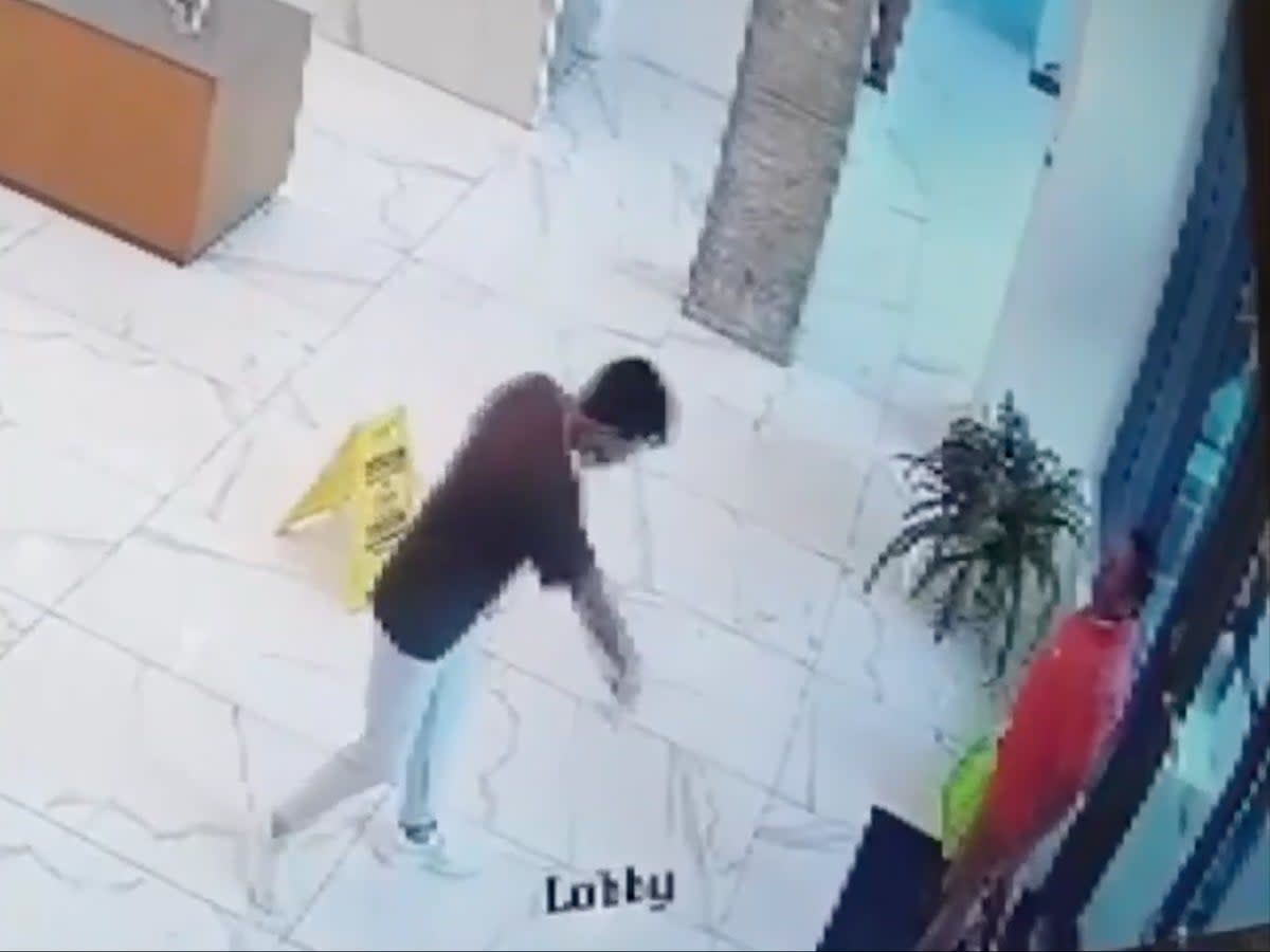 CCTV video showing the attack on a delivery driver  (WSVN-TV / Miami Plaza / Miami Police)