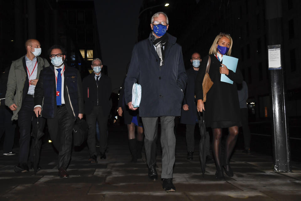 EU Chief negotiator Michel Barnier, centre, wears a face mask as he leaves The Westminster Conference Centre in London, Thursday, Oct. 22, 2020. Barnier is in London to resume talks over post Brexit trade agreements. It’s more than four years since Britain voted to leave the European Union, and almost a year since Prime Minister Boris Johnson won an election by vowing to “get Brexit done.” Spoiler alert: It is not done. As negotiators from the two sides hunker down for their final weeks of talks on an elusive trade agreement, Britain and the EU still don’t know whether they will begin 2021 with an organized partnership or a messy rivalry. (AP Photo/Alberto Pezzali)