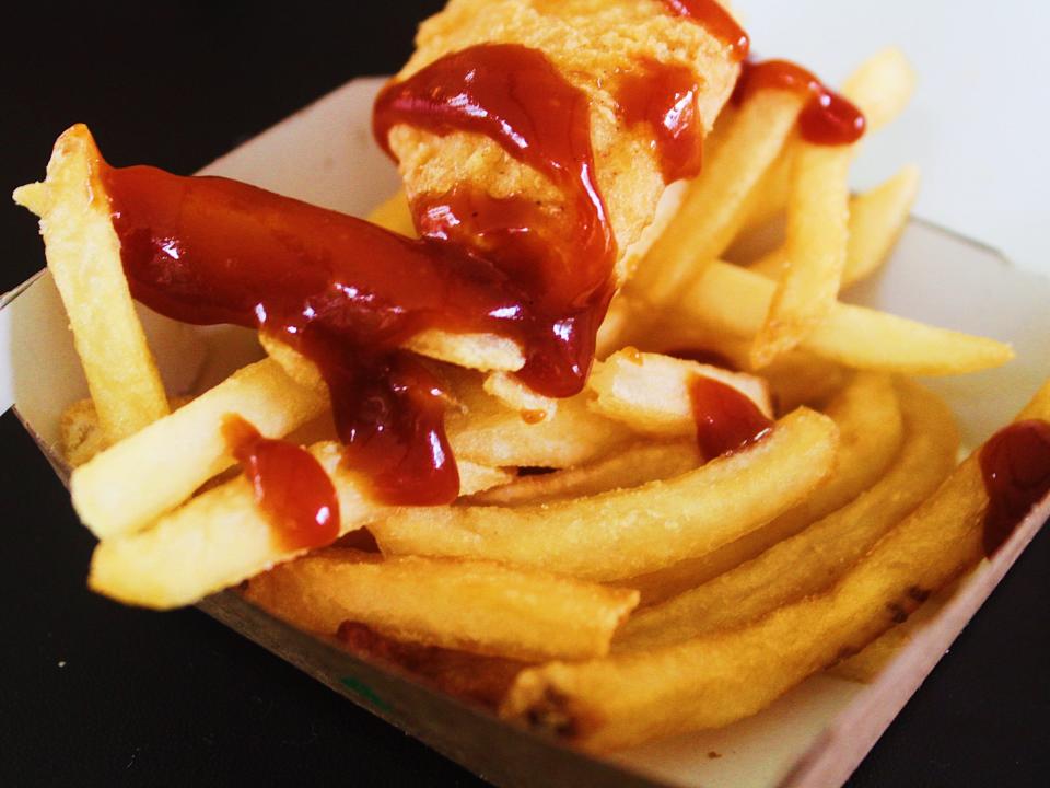 mcdonalds chicken nuggets and fries covered in bbq sauce