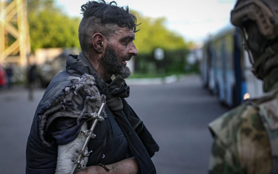 A Ukrainian serviceman boarding a bus as he is being evacuated from the besieged Azovstal steel plant in Mariupol - ALESSANDRO GUERRA/EPA-EFE/Shutterstock /Shutterstock 
