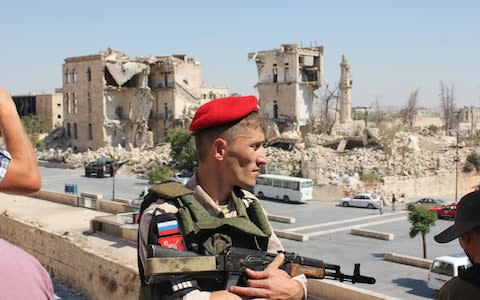 Russian military gives a press tour of destroyed parts of Aleppo, Syria.  - Credit: Alec Luhn for the Telegraph