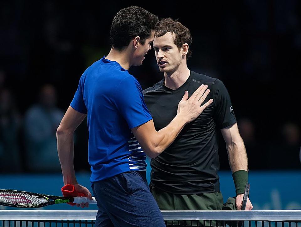 Two exhausted tennis players meet at the net after a draining semi-final at the ATP Tour Finals. (Mark Greenwood/IPS/REX/Shutterstock)