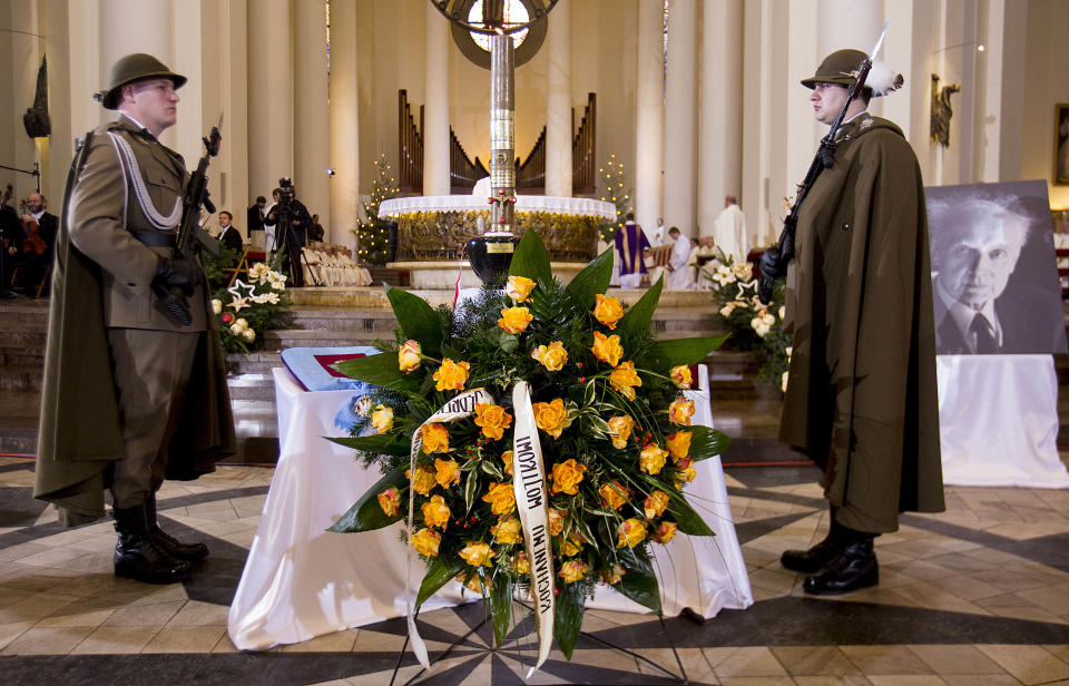 The dark stone urn with the ashes of Poland’s pianist and composer Wojciech Kilar placed in front of the altar during the composer’s state funeral at the Cathedral of Christ the King in Katowice, Poland, on Saturday, Jan. 4, 2014. Mourners, including Culture Minister Bogdan Zdrojewski, hailed Kilar, a symphonic composer, as a glorious figure in Polish and European music. He gained fame writing film scores for Oscar-winning "The Pianist" and "Bram Stoker's Dracula." Kilar, 81, died of cancer on Sunday Dec. 29, 2013, in his hometown of Katowice. (AP Photo/ Tomasz Dudzinski) POLAND OUT