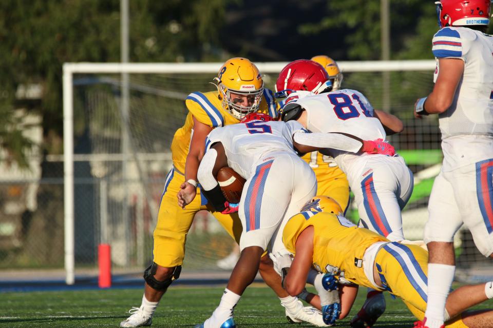 Clyde's Adam Kauble makes a tackle.