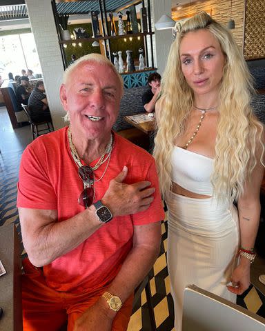 <p>Ric Flair Instagram</p> Ric Flair and his daughter Charlotte (née Ashley) Flair