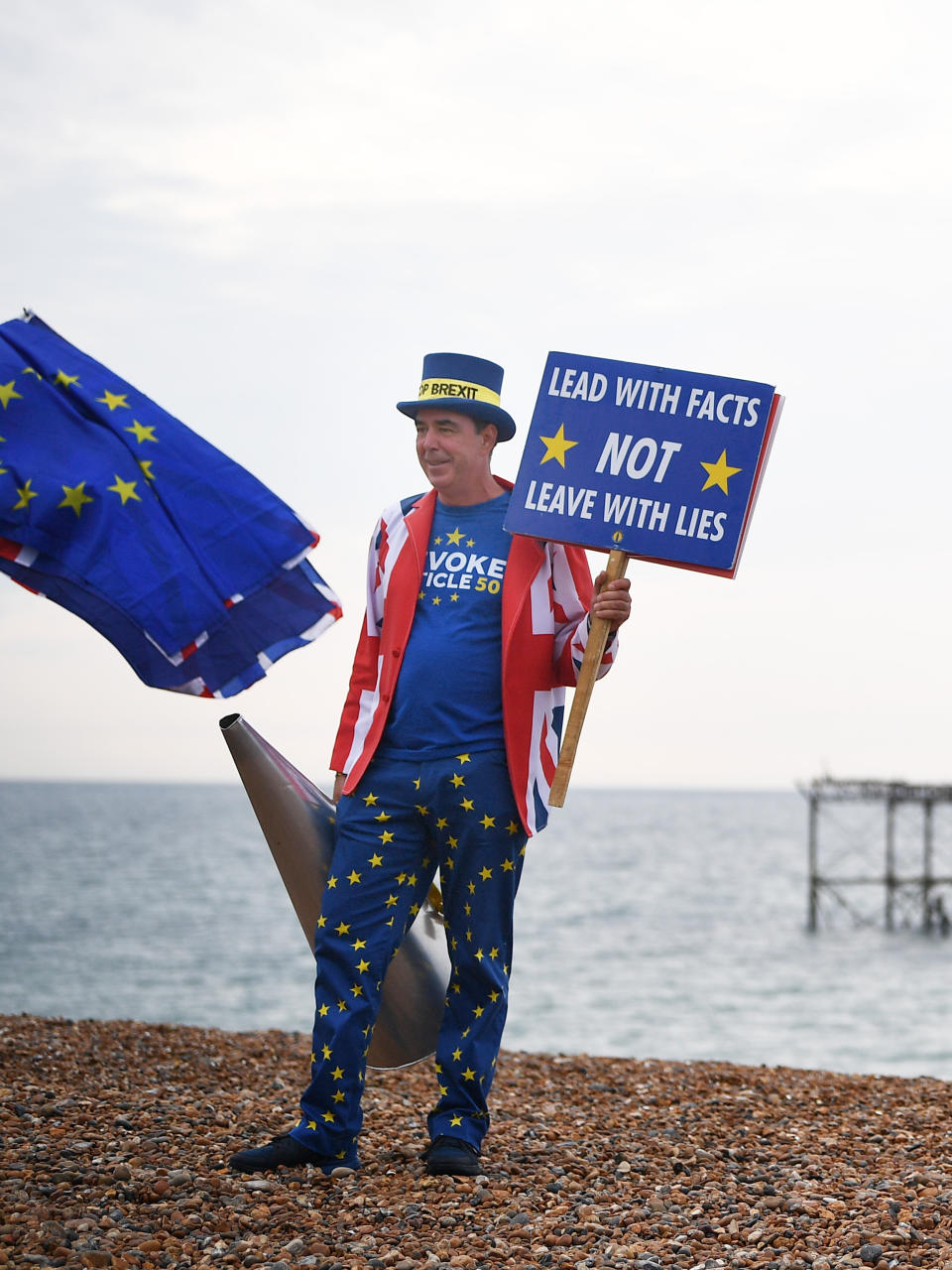 An Anti Brexit protester on Brighton beach during the Labour Party Conference at the Brighton Centre in Brighton.