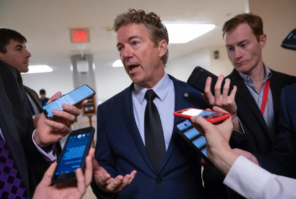Sen. Rand Paul, R-Ky., responds to reporters at the Capitol after he threatened to reveal the name of the Ukraine whistleblower who helped initiate the impeachment inquiry against President Donald Trump by providing details of Trump's call with the Ukrainian president, in Washington, Wednesday, Nov. 6, 2019.