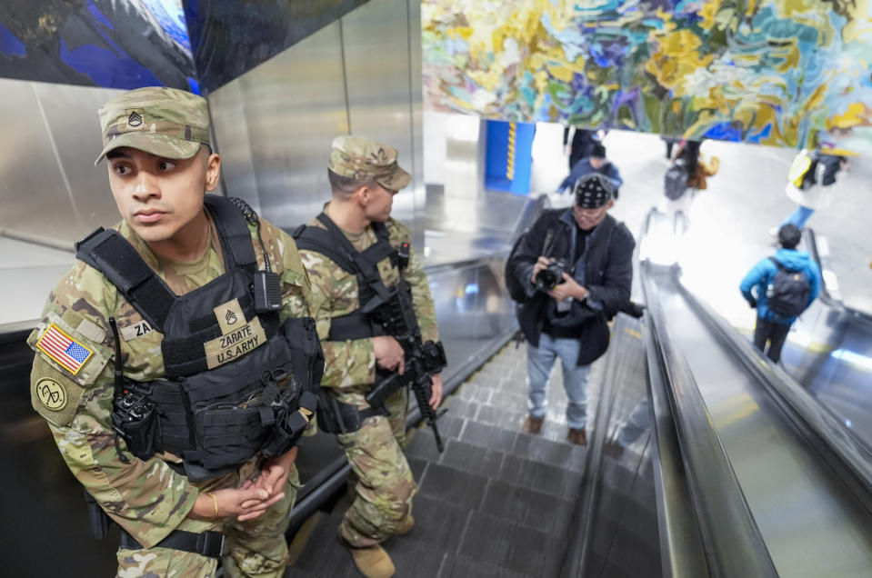 A couple of heavily armed New York National Guard soldiers patrol Grand Central terminal, Thursday, March 7, 2024, in New York. Gov. Kathy Hochul is sending the National Guard to the New York City subway system to help police search passengers’ bags for weapons. (AP Photo/Mary Altaffer)