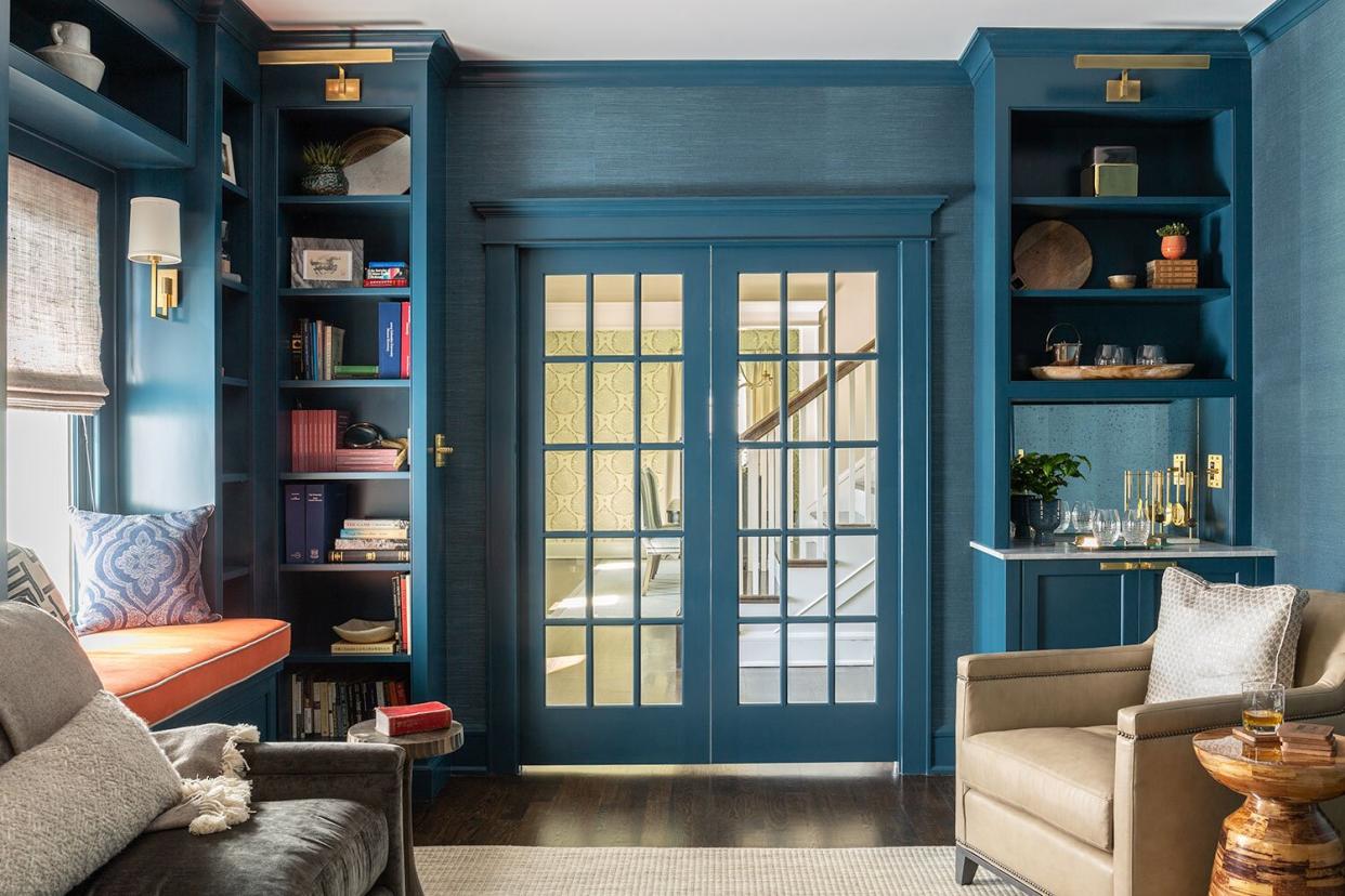 Sherwin-Williams Seaworthy SW 7620 in Library with Built-In Bookshelves and French Doors