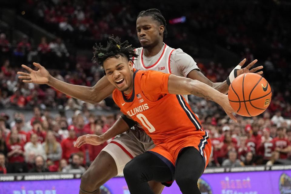 Illinois guard Terrence Shannon Jr. (0) loses the ball in front of Ohio State center Felix Okpara in the first half of an NCAA college basketball game Tuesday, Jan. 30, 2024, in Columbus, Ohio. (AP Photo/Sue Ogrocki)