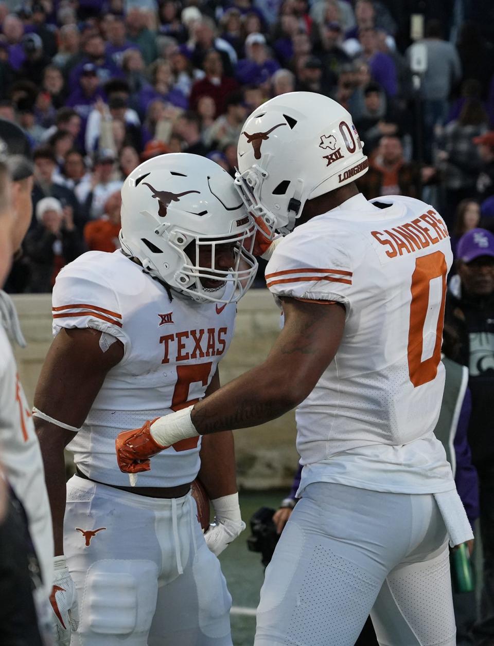 Will Bijan Robinson and the Texas Longhorns beat the TCU Horned Frogs in their Big 12 college football game on Saturday?