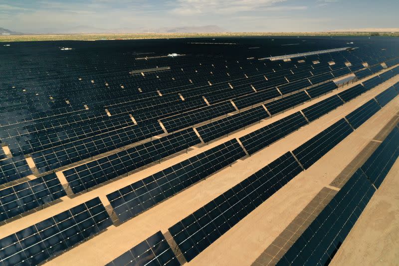 FILE PHOTO: Arrays of photovoltaic solar panels are seen at the Tenaska Imperial Solar Energy Center South as the spread of the coronavirus disease (COVID-19) continues in this aerial photo taken over El Centro, California