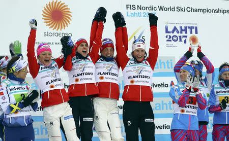 FIS Nordic Ski World Championships - Women's Cross-Country 4 x 5 km Relay - Lahti, Finland - 2/3/17 - Team Norway's Marit Bjoergen, Maiken Caspersen Falla, Heidi Weng celebrate after the race. REUTERS/Kai Pfaffenbach