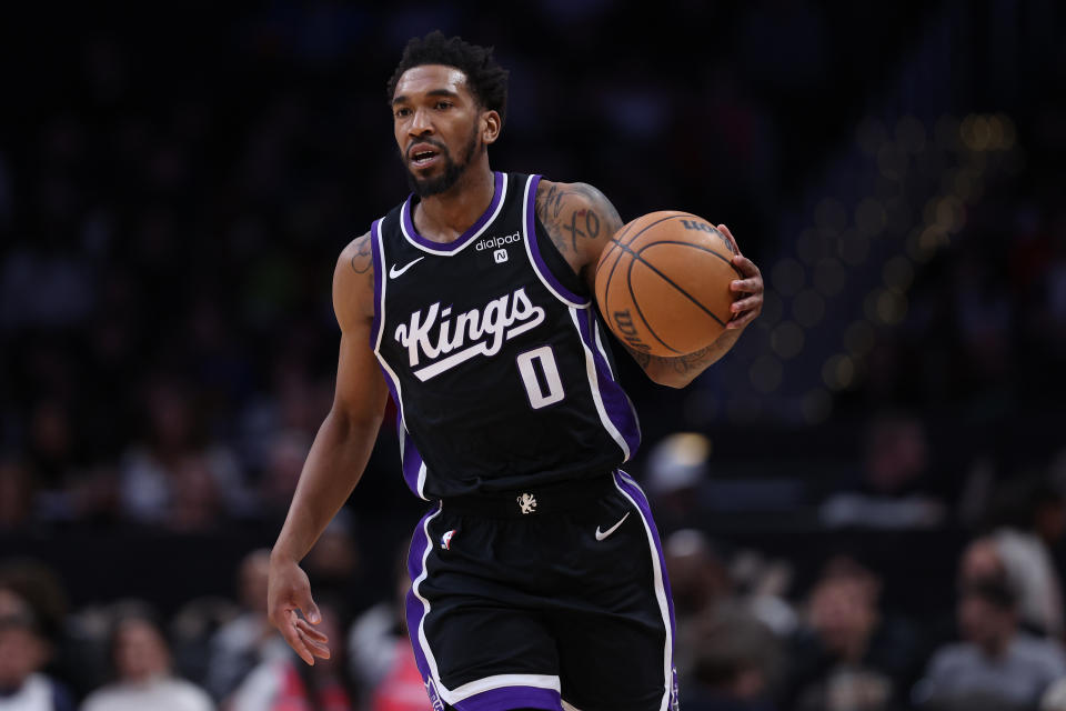 WASHINGTON, DC - MARCH 21: Malik Monk #0 of the Sacramento Kings dribbles the ball against the Washington Wizards during the second half at Capital One Arena on March 21, 2024 in Washington, DC. NOTE TO USER: User expressly acknowledges and agrees that, by downloading and or using this photograph, User is consenting to the terms and conditions of the Getty Images License Agreement. (Photo by Patrick Smith/Getty Images)