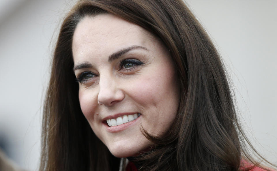 Britain's Kate, the Duchess of Cambridge, talks to runners as she prepares to take part in a relay race, during a training event to promote the charity Heads Together, at the Queen Elizabeth II Park in London, Sunday, Feb. 5, 2017. (AP Photo/Alastair Grant, Pool)