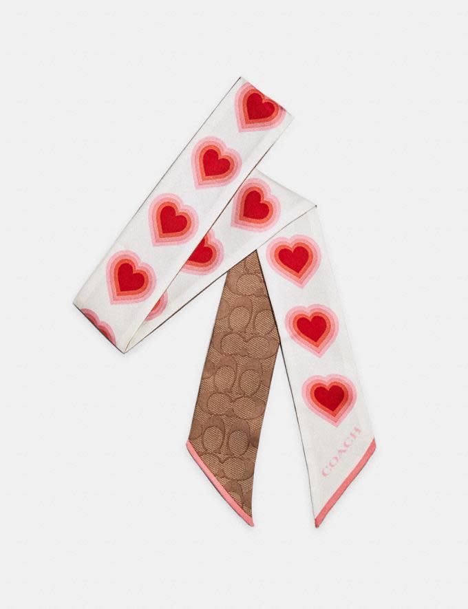 Signature 70'S Heart Print Silk Skinny Scarf. Image via Coach Outlet.