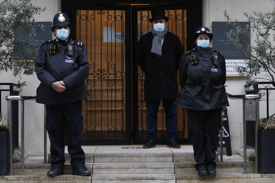 Police stand guard outside the King Edward VII hospital In London, Monday, Feb. 22, 2021, where Britain's Prince Philip is being treated. Prince Philip, 99, was admitted to the hospital on Tuesday on the advice of his doctor in what Buckingham Palace described as “a precautionary measure.” (AP Photo/Alastair Grant)