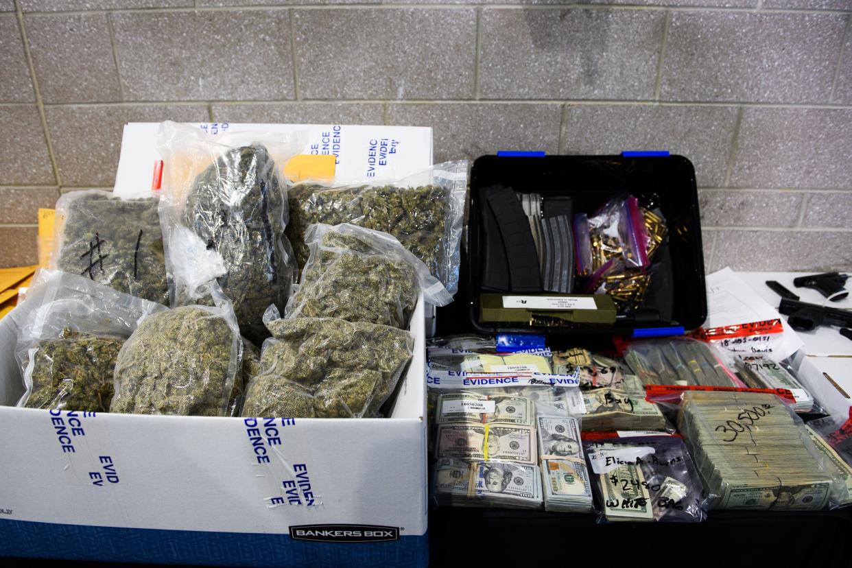 Large quantities of marijuana, money, firearms and other contraband sit on display during a Spartanburg County Sheriff's Office press conference on Operation Rolling Thunder's seizures on May 4, 2018.