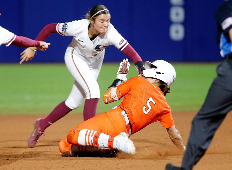 Oklahoma State's Kiley Naomi (5) is tagged out at second base in the third inning.