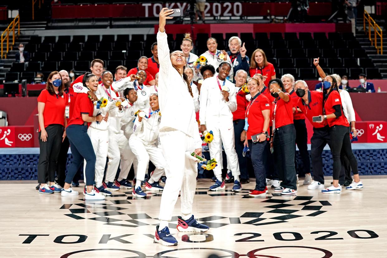 Aug 8, 2021; Saitama, Japan; United States centre Brittney Griner (15) takes a selfie as the United States celebrates winning the gold medal in the women's basketball gold medal match during the Tokyo 2020 Olympic Summer Games at Saitama Super Arena. Mandatory Credit: Kyle Terada-USA TODAY Sports