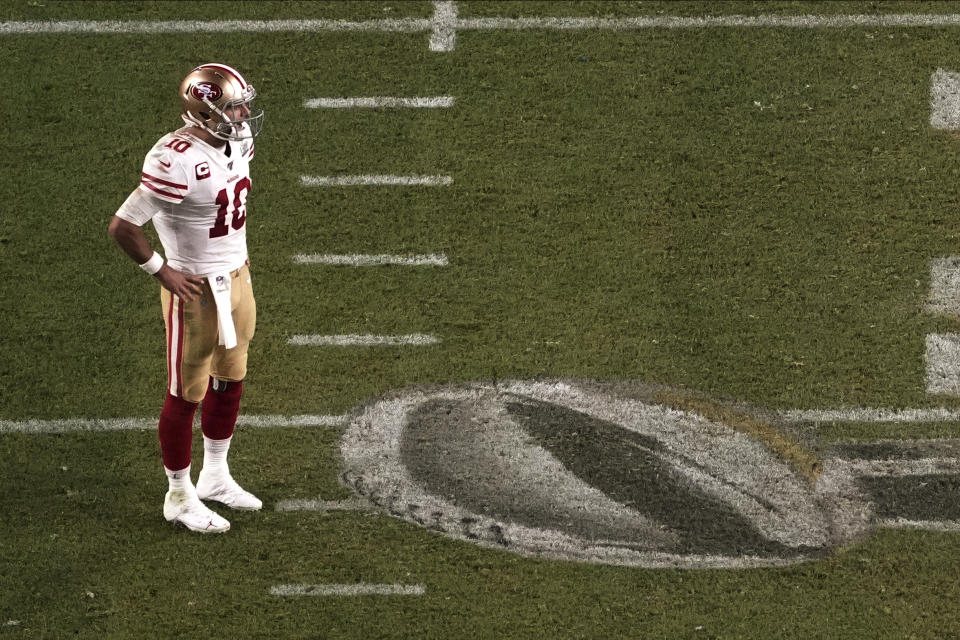 San Francisco 49ers quarterback Jimmy Garoppolo (10) stands on the field, during the second half of the NFL Super Bowl 54 football game against the Kansas City Chiefs', Sunday, Feb. 2, 2020, in Miami Gardens, Fla. (AP Photo/Morry Gash)