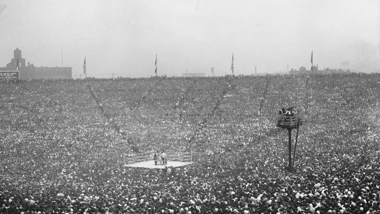 A sea of fans surrounds the ring. (Bettmann Archives/Getty Images)