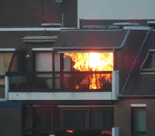 A reflection of a sunset that looks like a house is on fire